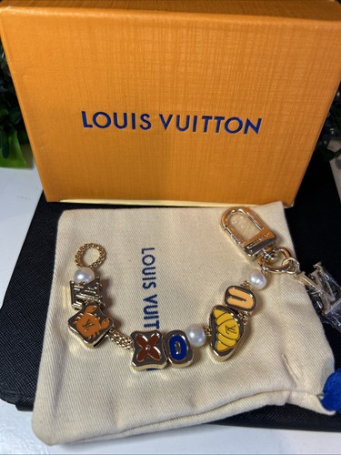 Louis vuitton accessorio charm - louis,